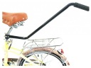 Zatlačte vodiacu rukoväť PRE učebný bicykel