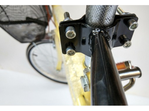 Zatlačte vodiacu rukoväť PRE učebný bicykel