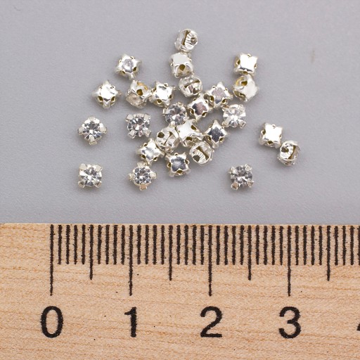 Kamienky na šitie, sklo/mosadz, okrúhle ploché číre 3x2,5 mm 144ks