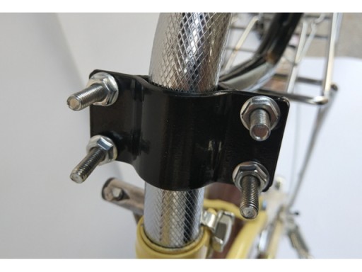 Zatlačte vodiacu rukoväť PRE učebný bicykel