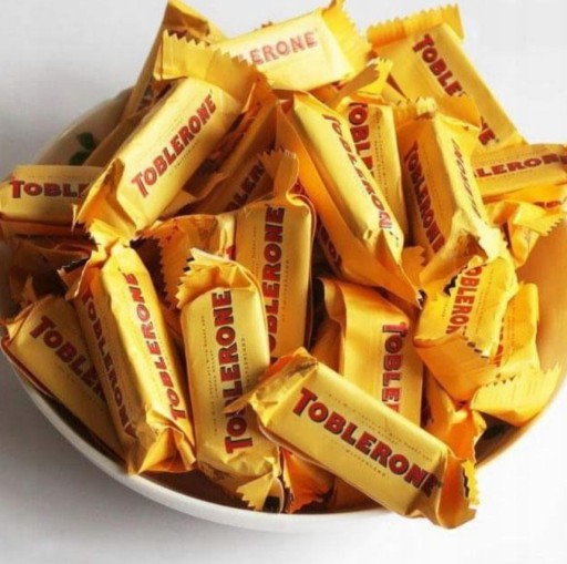 Toblerone mliečne tyčinky s medom a mandľami Medové mandľové tyčinky 200g