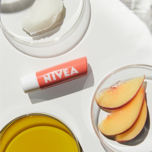 NIVEA PEACH SHINE Ochranný hydratačný rúž 4,8g