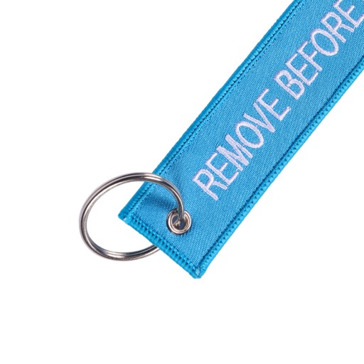 Modrý prívesok na kľúče RBF REMOVE BEFORE FLIGHT